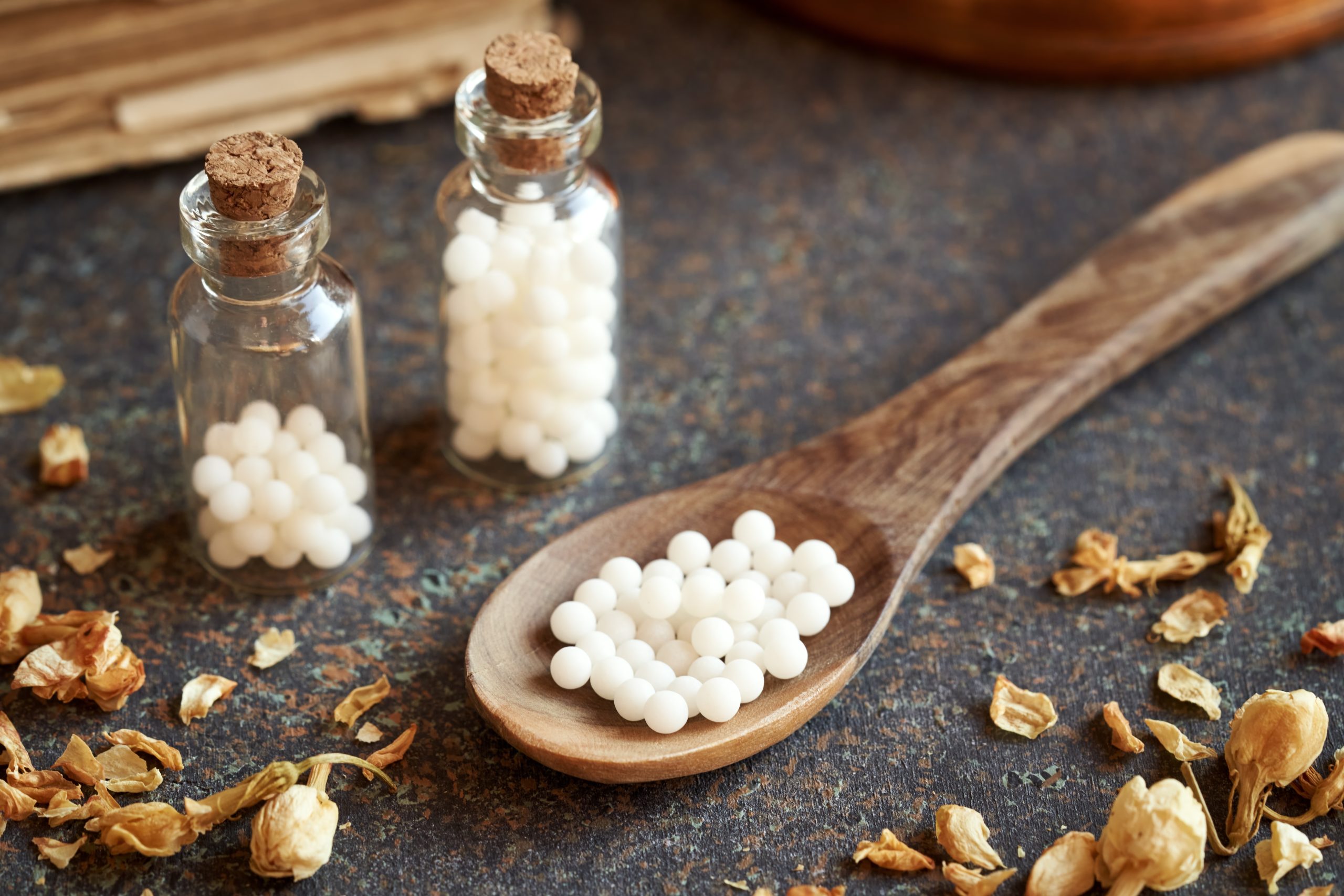 Homeopathic globules on a spoon - alternative medicine