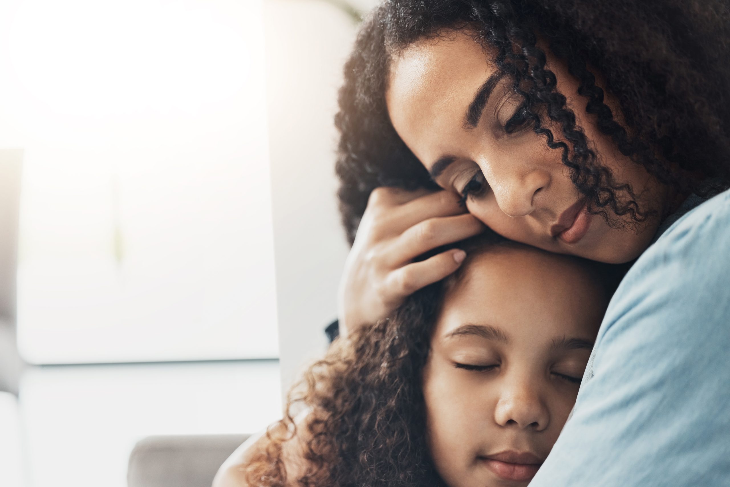 Love, care and mother hug girl in home, bonding and caring for child while enjoying time together. Family, affection and mom or mama hugging, cuddle and embrace kid for support, trust and comfort.